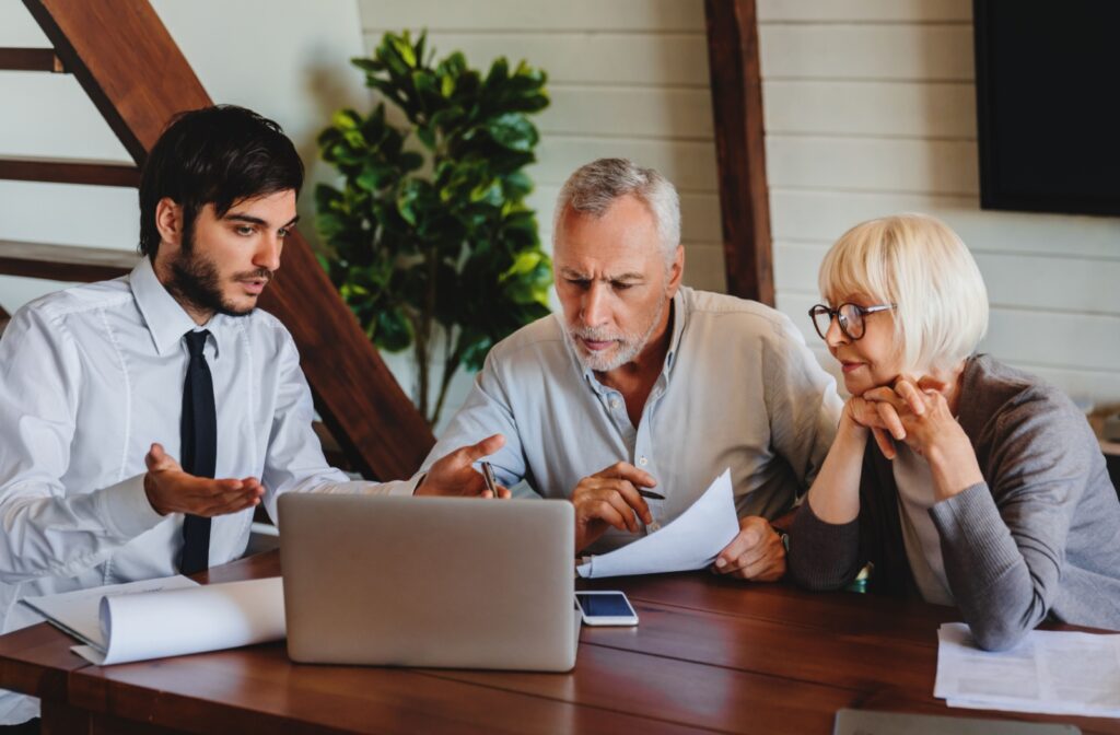A senior couple consult with a financial planner to make strategic choices to maximize their options for independent living