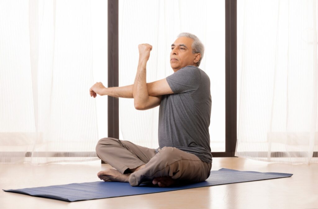 senior doing yoga in a senior living community
