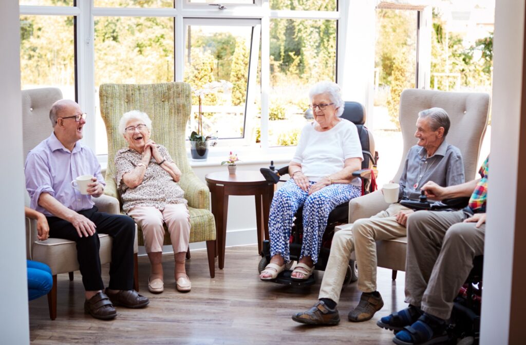 a group of seniors sitting in a room and chatting
