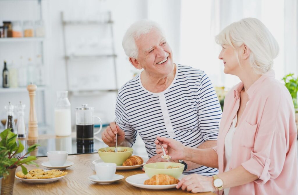 Elderly couple sitting and enjoying a nutritious breakfast